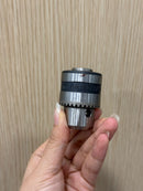 Aiko 3/8" drill chuck with key set, showing two metal drill chucks with keys for secure bit attachment and easy tightening.