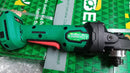 Newbeat 4-inch 21V cordless angle grinder with two batteries and charger, featuring a compact design and ergonomic handle.