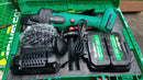 Newbeat 4-inch 21V cordless angle grinder with two batteries and charger, showing the compact power tool in use.